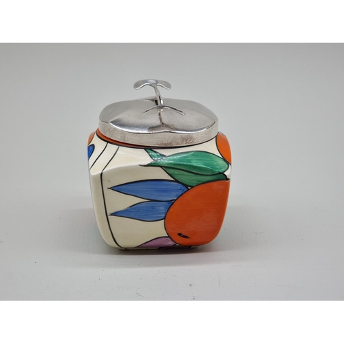 1608 - A Clarice Cliff 'Oranges' pattern preserve pot and metal cover, shape 516, the pot 8cm high.... 