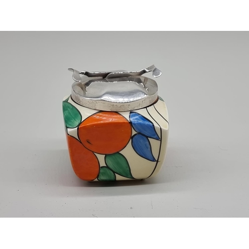 1608 - A Clarice Cliff 'Oranges' pattern preserve pot and metal cover, shape 516, the pot 8cm high.... 