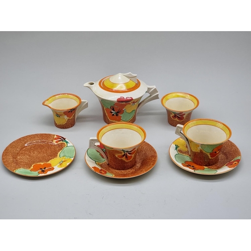 1610 - A Clarice Cliff 'Nasturtium' pattern Daffodil shape tea for two set, the teapot & cover 12cm hig... 