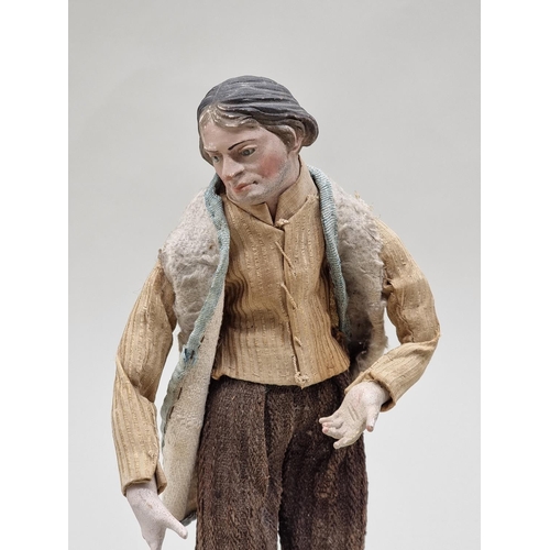 1613 - A Neopolitan creche figure of a shepherd, probably late 18th century, 31cm high.