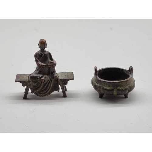 1631 - A miniature Chinese bronze twin handled tripod censer, seal mark to base, 5cm wide; together with a ... 