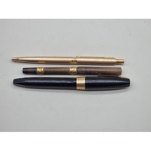 1642 - A vintage Sheaffer fountain pen; together with two other pens. 