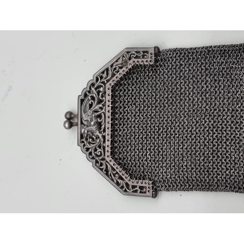 1643 - A vintage electroplated mesh purse; together with an old key. 