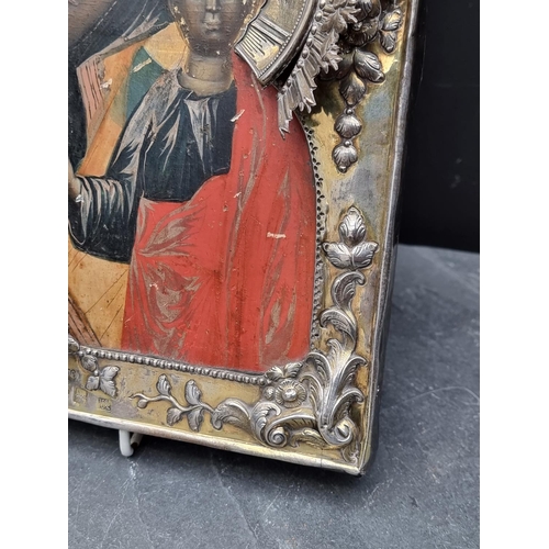 1657 - A good late 18th century Russian silver gilt mounted icon of Virgin and Child, tempera on wood panel... 