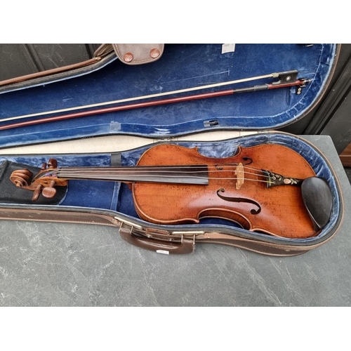 1665 - An antique Continental violin, with 14in one piece back, with bow and case.