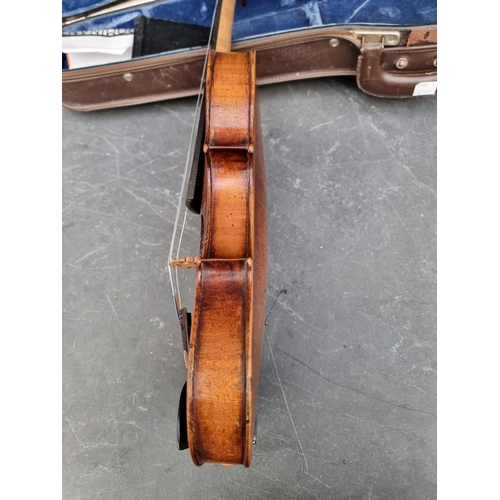 1665 - An antique Continental violin, with 14in one piece back, with bow and case.