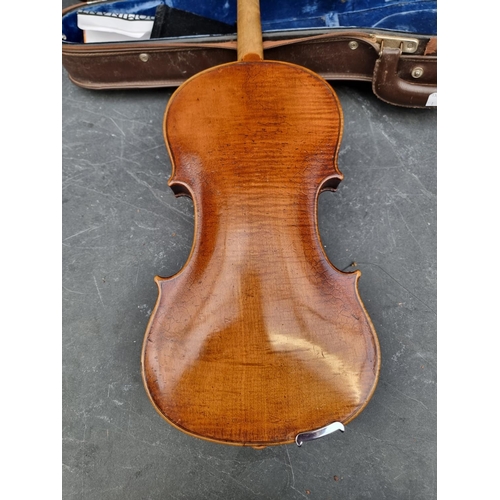 1665 - An antique Continental violin, with 14in one piece back, with bow and case.