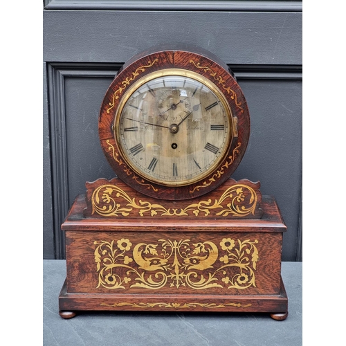 1673 - A George IV rosewood and brass inlaid drumhead fusee mantel timepiece, the 7in silvered dial 'Westwo... 