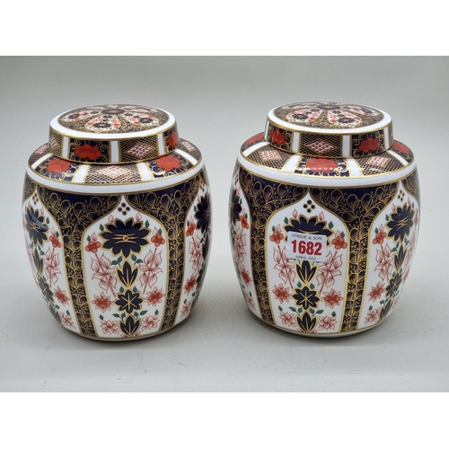 1682 - A pair of Royal Crown Derby Imari ginger jars and covers, 18cm high.