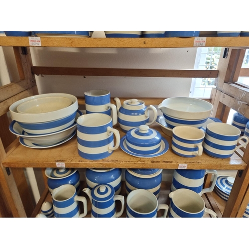 1690 - A large collection of T G Green & Co Cornishware jugs, jars and related, all unnamed, various da... 