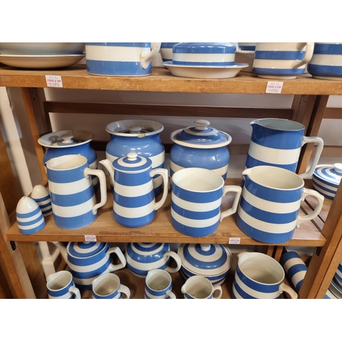 1690 - A large collection of T G Green & Co Cornishware jugs, jars and related, all unnamed, various da... 