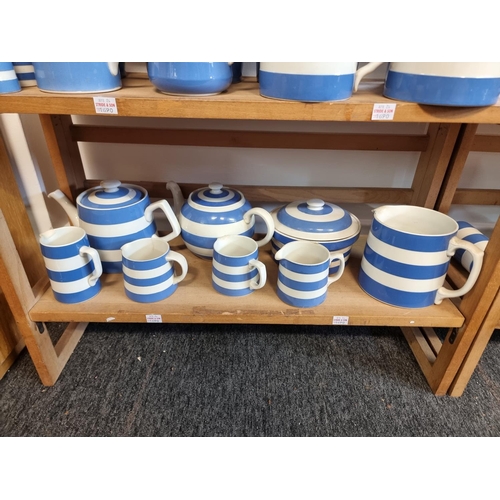 1690 - A large collection of T G Green & Co Cornishware jugs, jars and related, all unnamed, various da... 