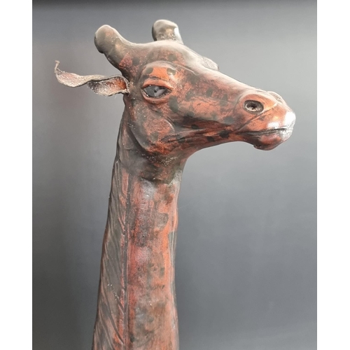 1717 - Two Liberty style tan leather giraffes, in the manner of Omersa, largest 74cm high.