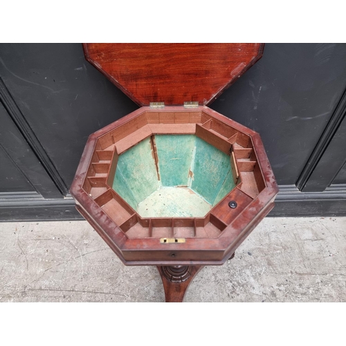 1057 - A Victorian mahogany octagonal trumpet work table, 42cm wide. 