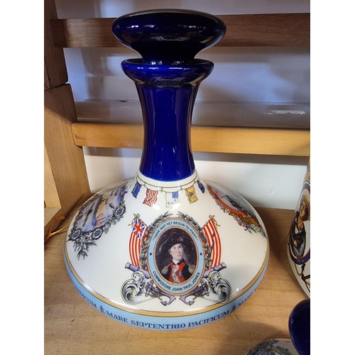 1740 - Two pairs of Pusser's rum decanters and stoppers, largest 22cm high; and a similar flagon. (5)... 