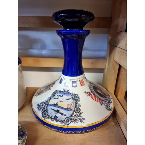 1740 - Two pairs of Pusser's rum decanters and stoppers, largest 22cm high; and a similar flagon. (5)... 