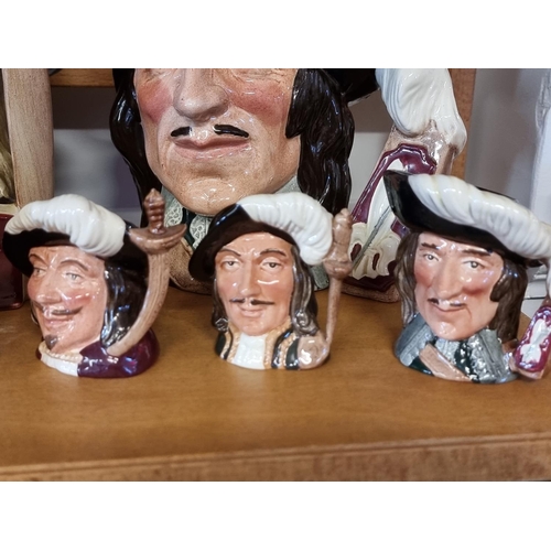 1749 - A collection of Royal Doulton musketeers character jugs. (12)