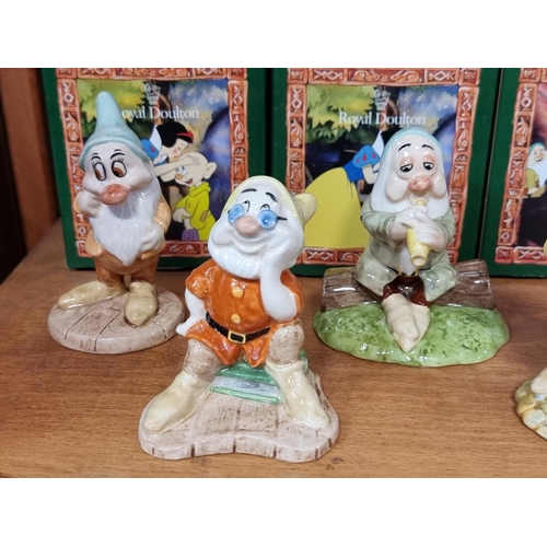 1752 - A set of Royal Doulton Snow White and The Seven Dwarfs figures, each boxed.