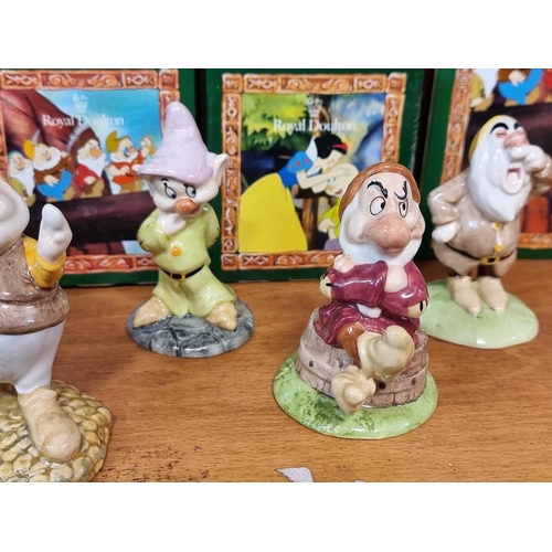 1752 - A set of Royal Doulton Snow White and The Seven Dwarfs figures, each boxed.