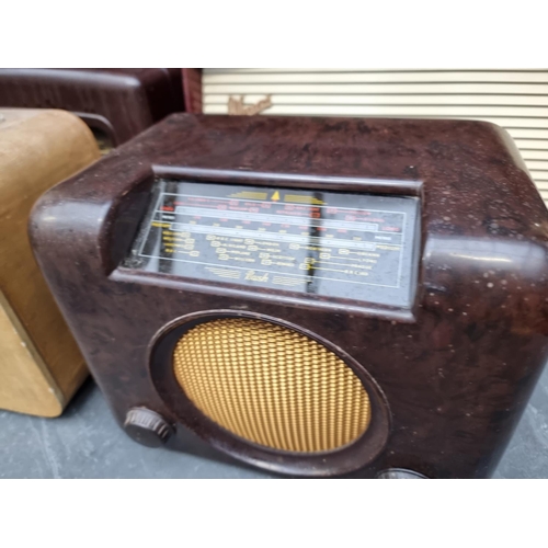 1777 - Four vintage radios, comprising a Bush Bakelite example; a Cossor Bakelite example; a Marconi T69DA;... 