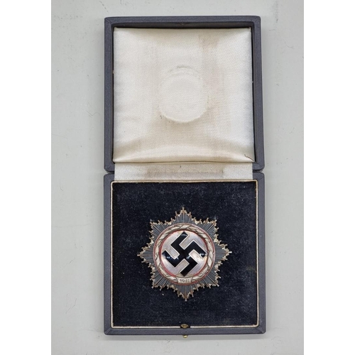 219 - Medals: a good quality reproduction Third Reich German Cross, in silver, boxed.... 