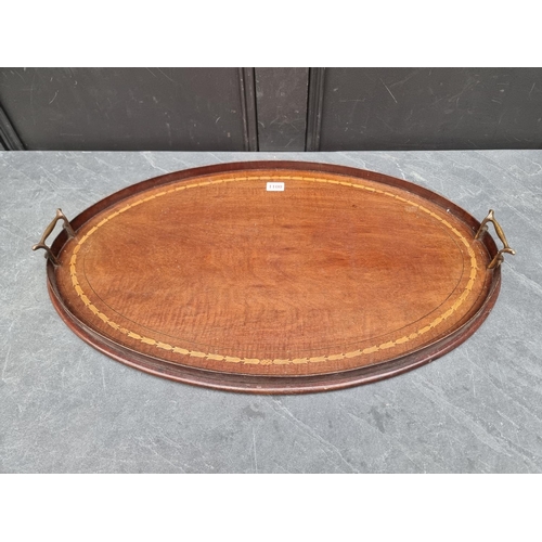 1100 - An Edwardian mahogany and inlaid twin handled oval gallery tray, 68cm wide. ... 