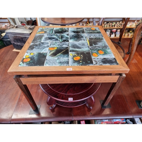 1103 - A vintage rosewood and tile top coffee table, 70.1cm wide, (crack to one leg). ... 