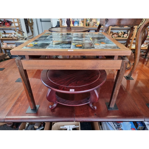 1103 - A vintage rosewood and tile top coffee table, 70.1cm wide, (crack to one leg). ... 