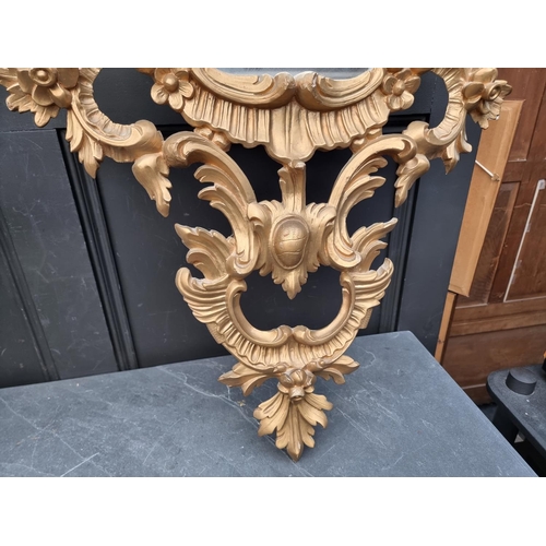 1112 - A pair of rococo style card giltwood frame wall mirrors, 114 x 67cm. (2)