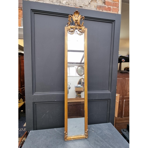 1113 - A gilt framed narrow pier style mirror, 155 x 29cm.