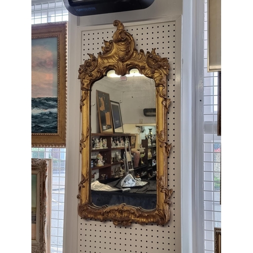 1117 - An 18th century carved gilt framed pier mirror, 95 x 46cm. 