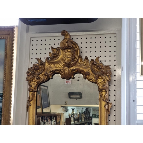 1117 - An 18th century carved gilt framed pier mirror, 95 x 46cm. 