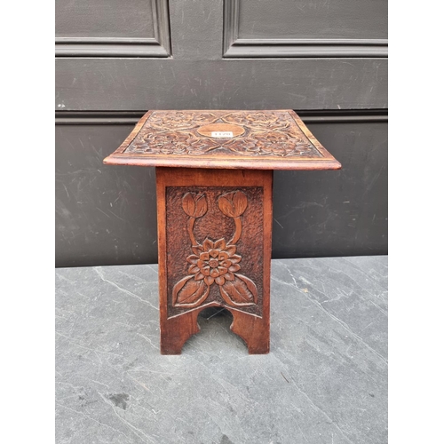 1120 - A small Arts and Crafts style carved pine occasional table, 28.5cm wide. 