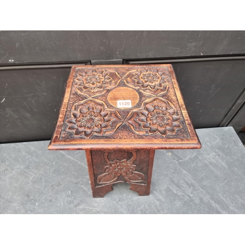 1120 - A small Arts and Crafts style carved pine occasional table, 28.5cm wide. 