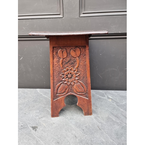 1120 - A small Arts and Crafts style carved pine occasional table, 28.5cm wide. 