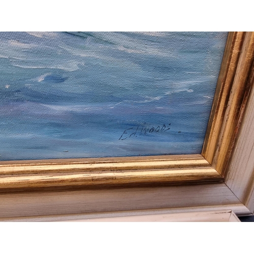 1349 - E A Woods, a yacht, signed, oil on canvas, 49 x 59.5cm; together with another similar by the same ha... 