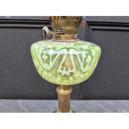 1513 - A Victorian brass and vaseline oil lamp, height excluding chimney 56cm.