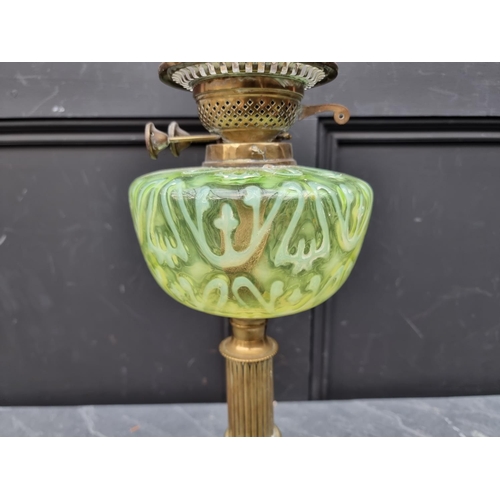 1513 - A Victorian brass and vaseline oil lamp, height excluding chimney 56cm.