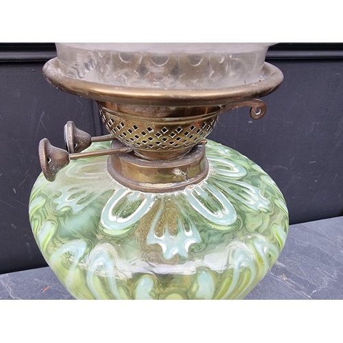 1513 - A Victorian brass and vaseline oil lamp, height excluding chimney 56cm.