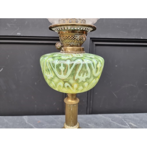 1513 - A Victorian brass and vaseline oil lamp, height excluding chimney 56cm.