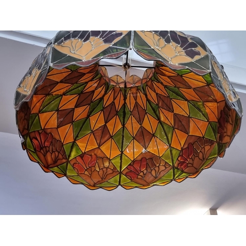 1668 - A large Tiffany style lamp shade, 64.5cm wide.