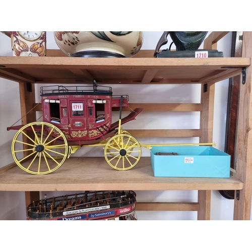 1711 - An old scratch built painted wood model stage coach, the wheel base 24.5cm; together with a similar ... 