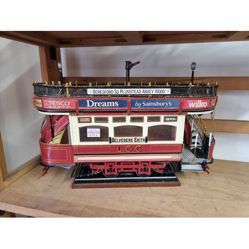 1711 - An old scratch built painted wood model stage coach, the wheel base 24.5cm; together with a similar ... 