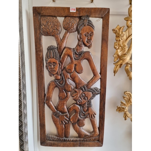 1718 - Ethnographica: an African tribal carved hardwood panel, 90 x 43cm. 