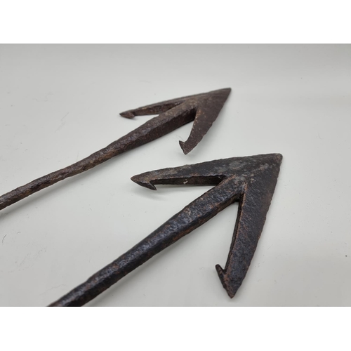 1764 - Two 19th century steel whaling harpoons, largest 97cm long.