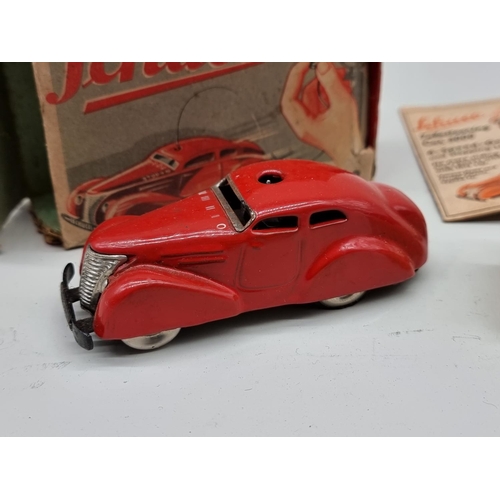 1833 - Schuco: a vintage red Schuco Telesteering car 3000, with box, key, instructions and accessories... 