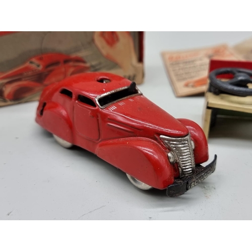 1833 - Schuco: a vintage red Schuco Telesteering car 3000, with box, key, instructions and accessories... 