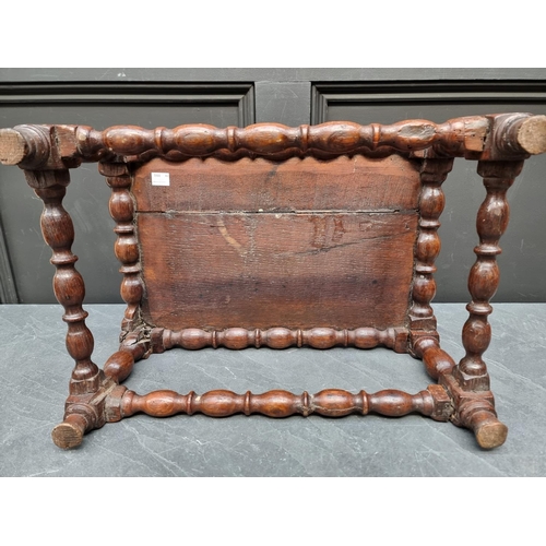 1065 - An 18th century oak reel turned stool, 46.5cm wide.