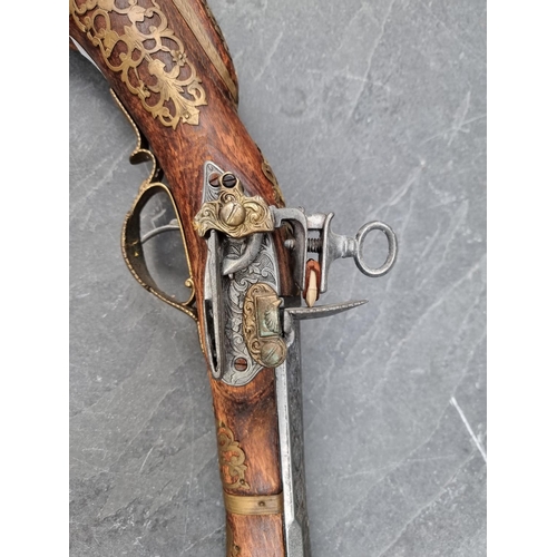 1170 - A reproduction flintlock musket; together with two similar pistols. (3)