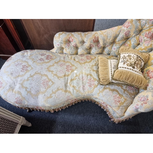 1079 - A Victorian button upholstered chaise longue, of shaped outline, approx 180cm wide.